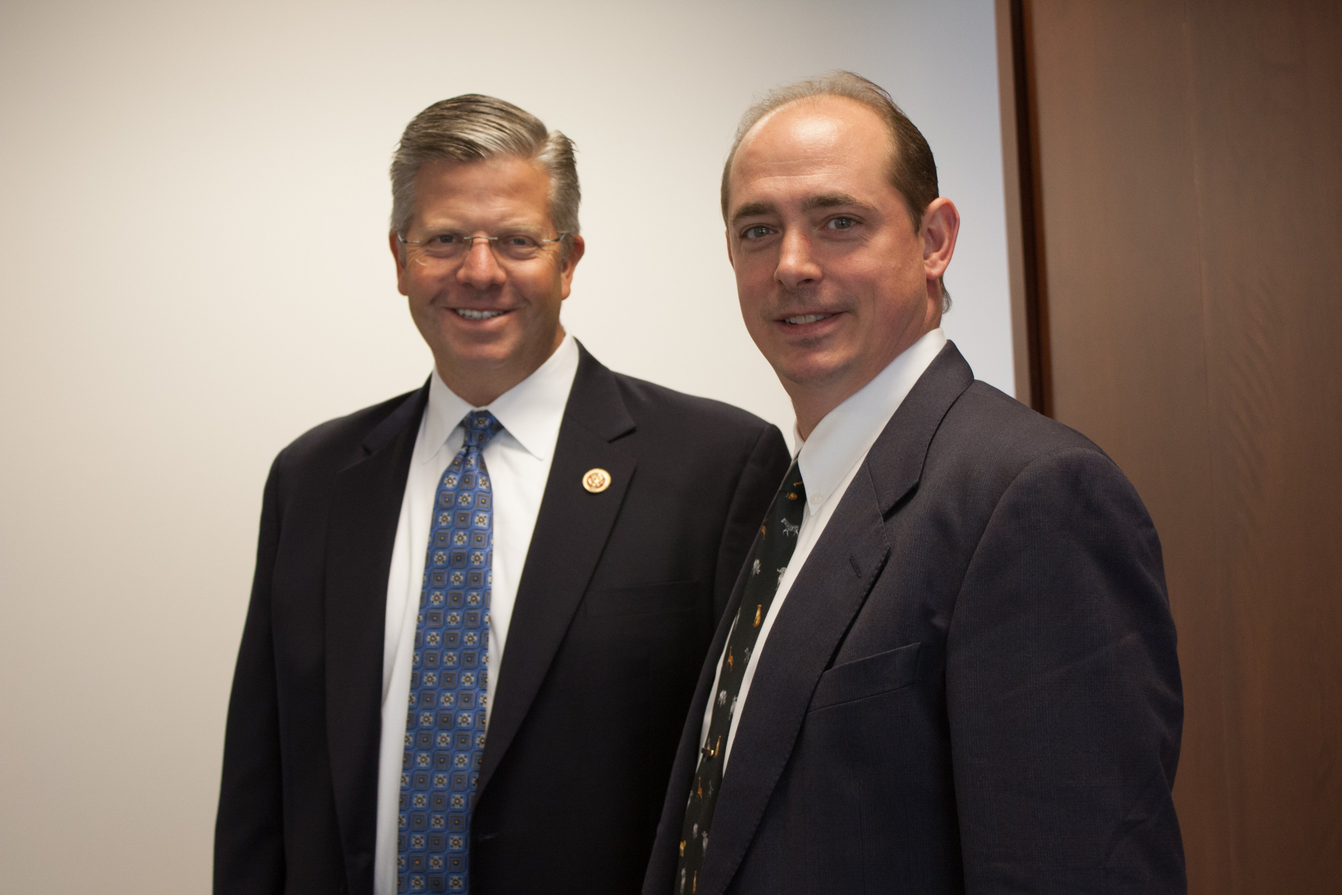 Rep. Randy Hultgren, and Met-L-Flo President Carl Dekker